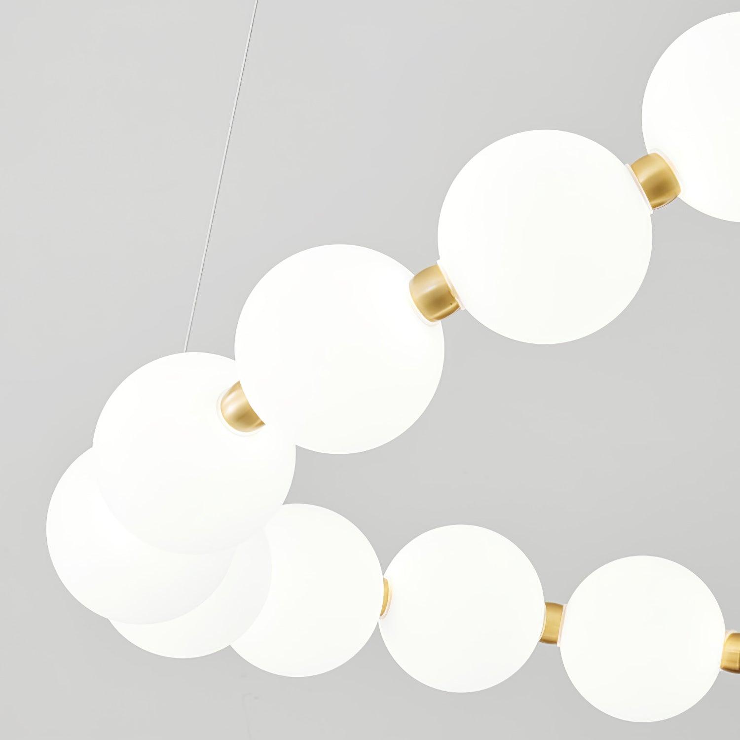 Tesi | Kugel Kronleuchter aus Messing und Acryl